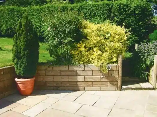 stone garden steps with retaining wall in landscaped garden